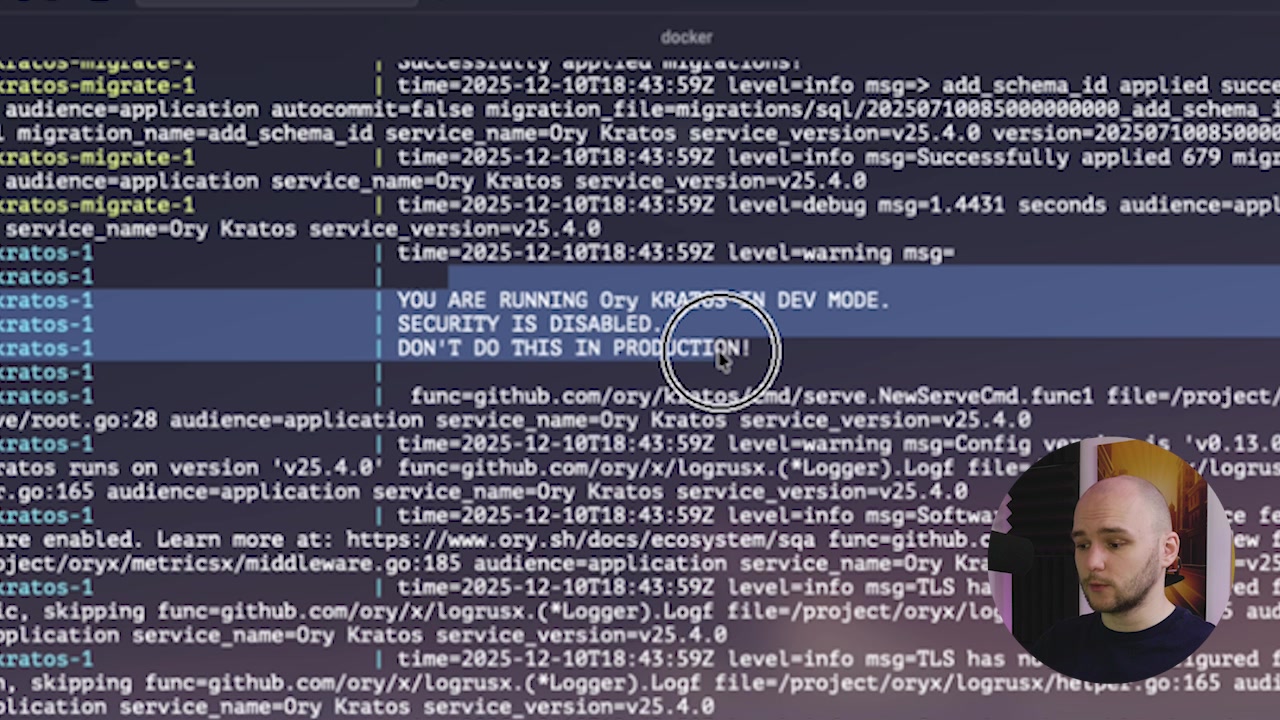 A screenshot of the terminal output showing the "YOU ARE RUNNING Ory Kratos IN DEV MODE. SECURITY IS DISABLED." message, confirming a successful launch.